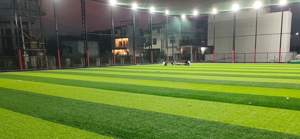 Player's GreenTruf artificial soccer and cricket turf at night